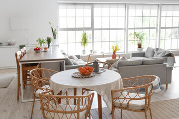 Interior of light open space studio apartment with kitchen and living room