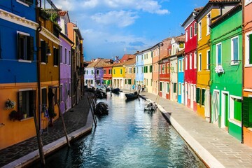 Canal surrounded by colorful buildings in Murano
