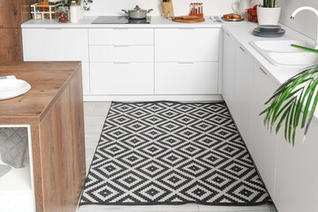 Stylish carpet in interior of modern kitchen