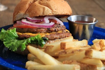 Closeup of French fries with burger