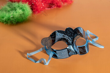 Venetian carnival mask, forming frame in one of the lower corners with space for text