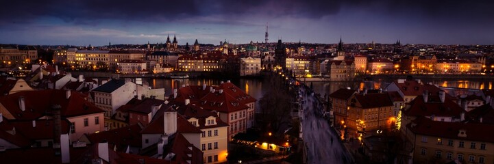 Panoramic shot of Prague surrounded by illuminated streets at night in the Czech Republic
