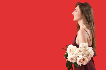 Beautiful young woman with bouquet of peony flowers on red background