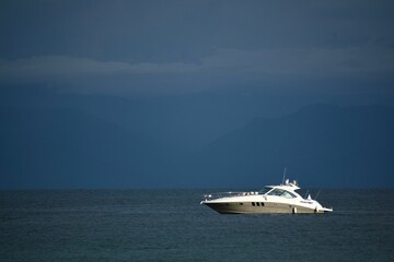 Fototapeta na wymiar Sea Ray Sundancer motor yacht on a voyage on a scenic blue sea