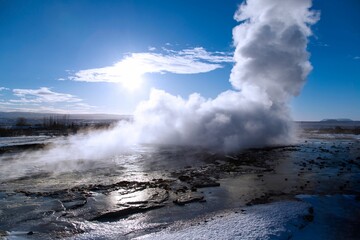Closeup shot of a hot geysir spring coming out of the earth on a cold winter day - Powered by Adobe