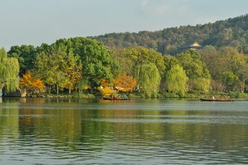 Colorful autumn maple trees on the shore of West Lake, Hangzhou, China