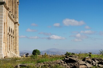 Fototapeta premium Queen's palace of Madagascar with a field in front of it under the blue sky in Antananarivo