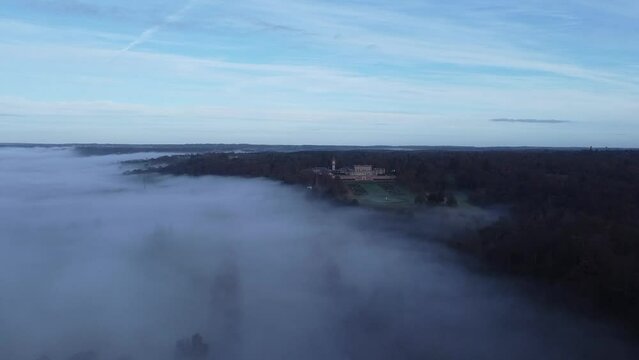 Drone footage on the forests under the fog and clouds