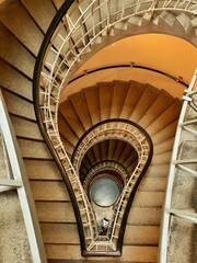 Fototapeta premium Vertical shot of indoor staircase in Prague, Czech Republic