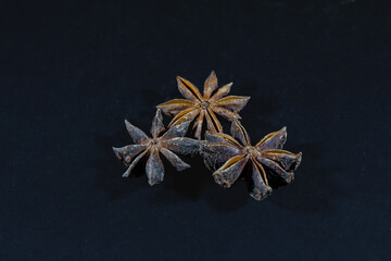 Selective blur on star anise, three stars, isolated on a black background. Anise, or aniseed, is a spice, the flowering plant of Apiaceae.