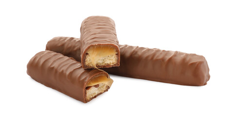 Sweet tasty chocolate bars with caramel on white background