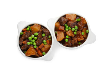 Delicious beef stew with carrots, peas and potatoes on white background, top view