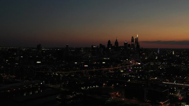 Drone footage of the skyline and skyscrapers of Philadelphia city in USA at sunset