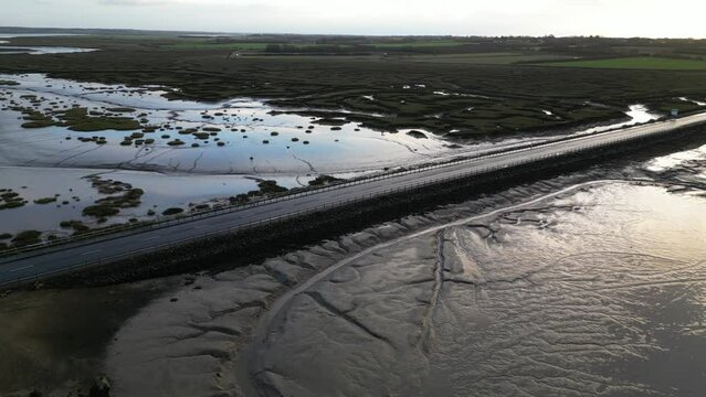 Drone footage of The Stroud causeway to Mersea Island at low tide.