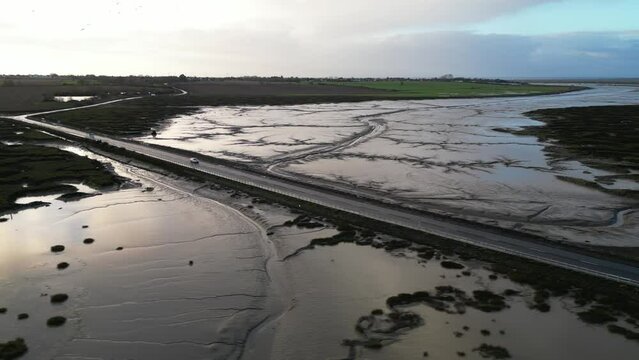 Drone footage of The Stroud causeway to Mersea Island at low tide.