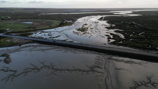 Drone footage of The Stroud causeway to Mersea Island at low tide.