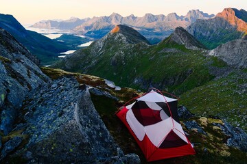 Tent in the scenic mountains at daytime
