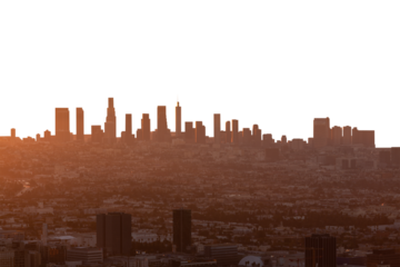 Smoggy orange sunrise cityscape view of Los Angeles and Hollywood from hilltop in the Santa Monica Mountains.    Isolated with cut out sky.