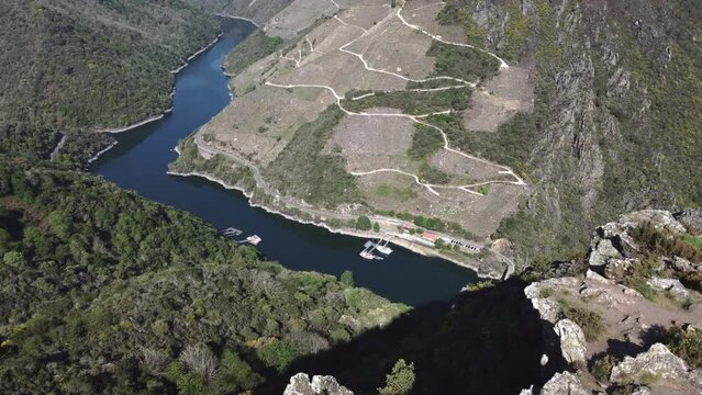 Aerial of the Sil river surrounded by the big mountains of the Sacra Canyon in Galicia, Spain