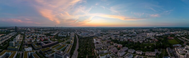 Fototapeta premium Drone panoramic view of sunset cloudy sky over Munich cityscape