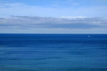 Beautiful view of a blue sky with clouds over the blue sea.