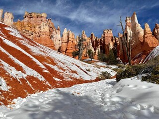Beautiful shot of the scenic stone formations covered in snow in Bryce Canyon, Utah