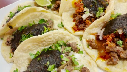 Close-up of a plate of assorted tacos with various fillings