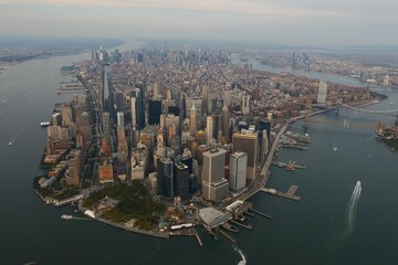Drone view of the cityscape of New York City with skyscrapers surrounded by water in USA