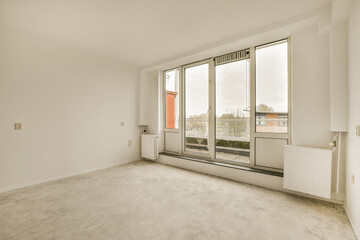 Obraz premium an empty room with large windows and no one person in the room to see what they are looking out at