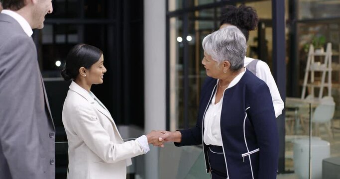 Business people, greeting and shaking hands for introduction, meeting and hello in office. Employees, handshake and welcome to networking, collaboration and onboarding for b2b partnership opportunity