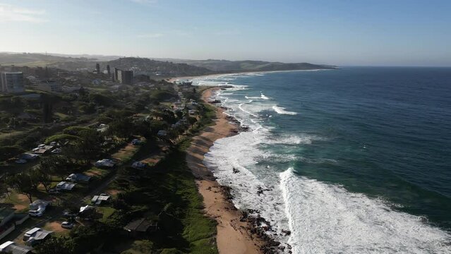 Aerial shot of waves washing the coastline in Scottburgh South Africa