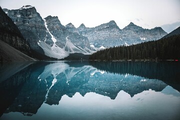 Beautiful view of Moraine lake with a reflection of snow covered mountain range
