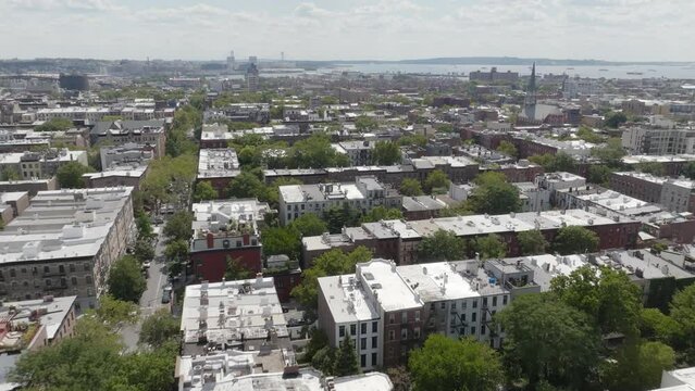 The row houses of Cobble Hill are accented by tree-lined streets in Brooklyn