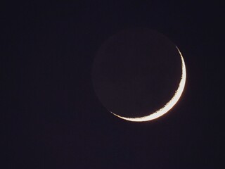 Closeup shot of the crescent moon isolated on a dark sky background