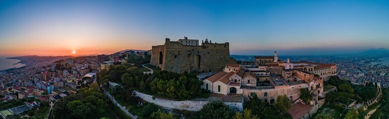 Fototapeta na wymiar Panorama of the great castle with a sunset on the horizon