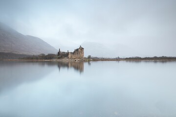 Aerial view of Kilchurn castle surrounded by water in Scotland