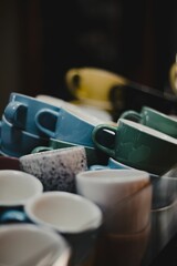 Vertical shot of many ceramic cups