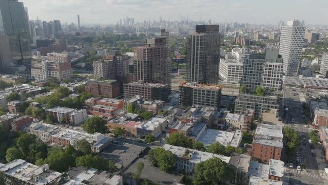 Flying over a Brooklyn neighborhood toward the East River