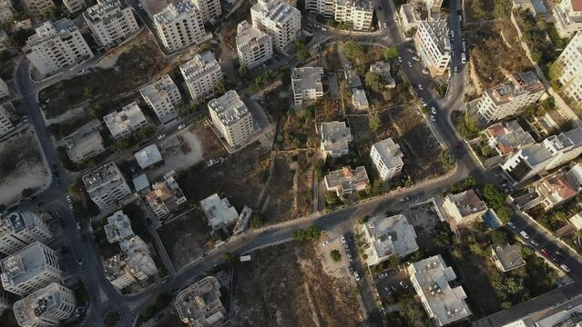 Aerial video of the white residential tall buildings, Ramallah city, Palestine