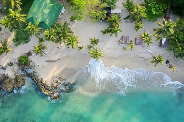 Top aerial view of beach on a sunny day in Columbia, water washing sandy beach