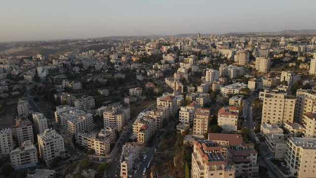 Aerial video of the white residential tall buildings, Ramallah city, Palestine