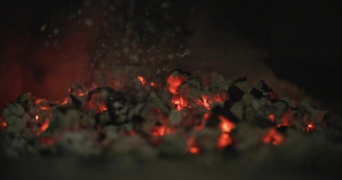 Coals during an extinct fire due to water spilled on it