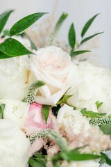 a vase of flowers with white and pink blooms on it