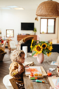 Adorable toddler girl painting