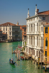 An aerial view of a gondola sailing through Venice