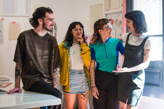 Fun portrait of co-workers in the tattoo studio office