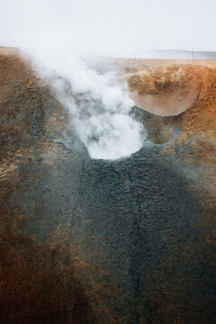 Smoking Fumaroles With Emitting Volcanic Vapor. Natural landscape.