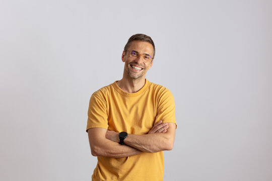 Man with a big smile and a yellow T-shirt