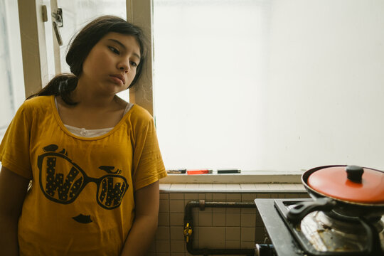 cute girl bored in the kitchen