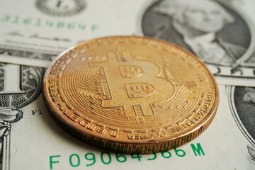 Golden bitcoin on US dollar banknotes money for business and commercial, Digital currency, Virtual cryptocurrency, blockchain technology.
